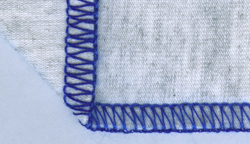 overlock stitch on a grey fabric