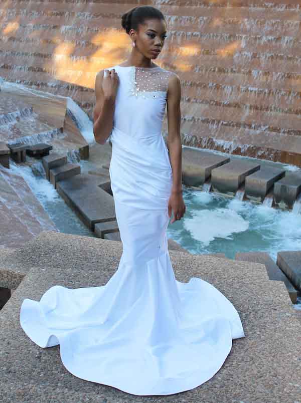 woman wearing a white mermaid’s tail dress