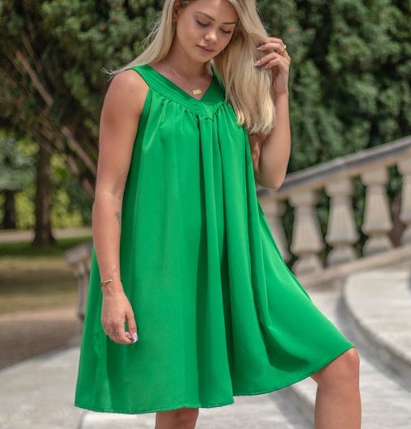woman wearing a green yoke dress